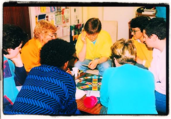 Adults playing Trivial Pursuit